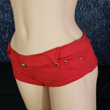 Brazilian Cheek Shorts with Sexy Strappy Back to Show Off Your Cheeks! Studded Belt Loops, Faux Pockets, and Straps with Metal Button Stud on Waistband.