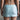 Flirty Mini Skirt. Waist Band. Reversible Keyhole Feature in Front or Back. In Stretch Satiné Fabric. 568
